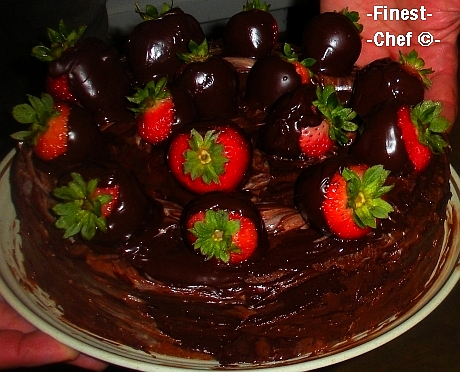 Chocolate cake with chocolate-dipped strawberries