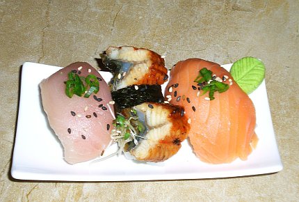 Nigiri sushi of albacore tuna, salmon and bbq eel.